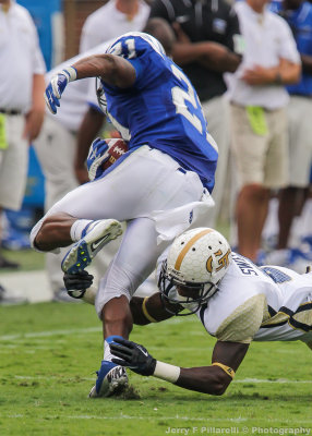 Yellow Jackets CB Sweeting makes an open field tackle on Blue Raiders RB Drayton Calhoun
