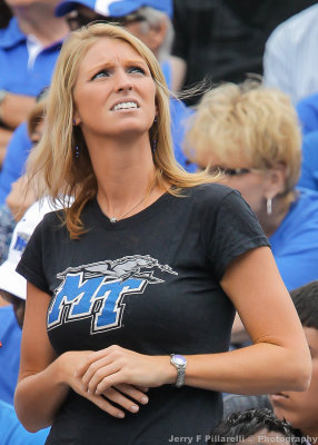 Blue Raiders Fan checks the scoreboard during the second half