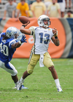 Georgia Tech QB Washington throws under pressure from Blue Raiders LB Leighton Gasque