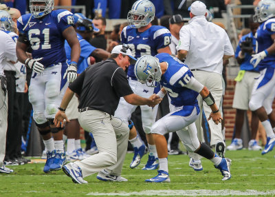 Middle Tennessee State QB Kilgore is congratulated by one of his coaches after a score