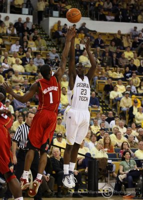 Tech G Morrow puts up a trey over Terrapins F Landon Milbourne