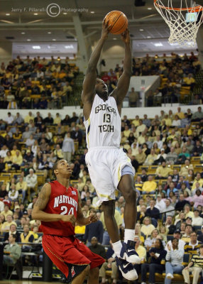 Tech G DAndre Bell goes up for the slam as Maryland G Cliff Tucker trails the play