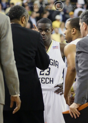 Georgia Tech G Morrow listens intently to Coach Hewitt during a timeout