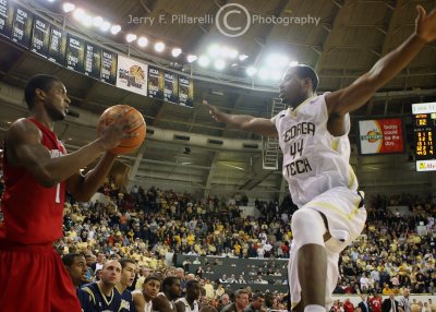 Tech F Aminu looks to disrupt the in-bounds pass of Maryland F Milbourne