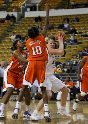 Georgia Tech F Ardossi looks to make a move in the lane while surrounded by Clemson defenders