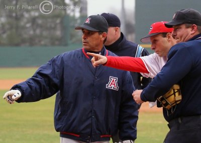 Arizona Coach Andy Lopez and the umpires get a rundown of the ground rules from Georgia Coach David Perno