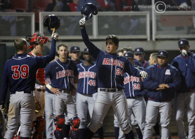 Arizona 1B Ziegler celebrates at home with teammates after hitting a home run