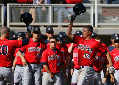 and celebrates at home with his Arizona Wildcats teammates