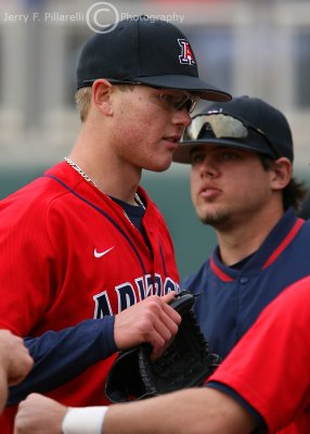 Wildcats P Perry gets congratulated in the dugout after striking out the side