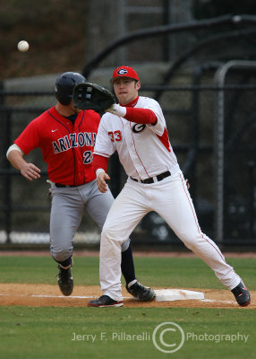 Georgia 1B Rich Poythress takes the throw from the pitcher to hold UA DH Glenn on first