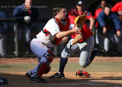 …as Arizona RF Jon Gaston bears down on home plate…