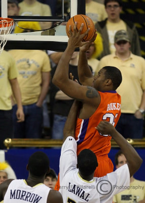 Tech F Lawal attempts to stop Tigers C Booker as he elevates to the basket