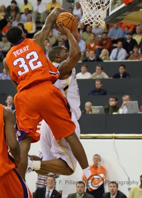 Georgia Tech F Smith has his shot disrupted by Clemson F Sam Perry