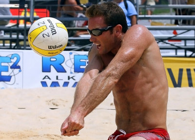 Arizona Alumni Matt Olson receives a serve