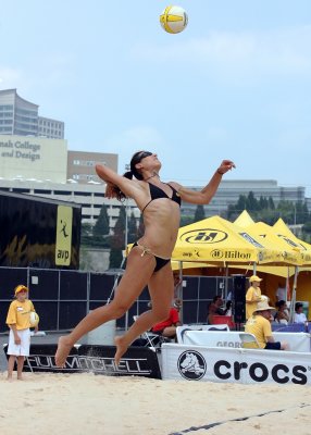 Akers soars toward contact on her serve