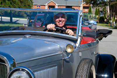 Foreign motorist driving vintage Ford