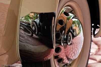 Reflection of 1931 Auburn in 36 Cord Hubcap