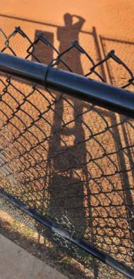 A Shadowy Character With A Ladder