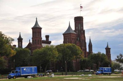 The Smithsonian Castle With Matching Trucks