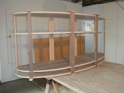 The frame was made from 4 sheets of plywood.  The middle two will remain as shelves. 051204_04.jpg