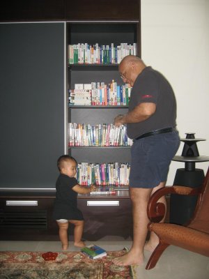 So nikki, where shall we go for next trip? papa and nikki discussing in front of papa's travel book collection..