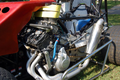 The car is powered by a 600 CC Yamaha motorcycle engine and is slung low on the left side of the car. It's done so because it helps to distribute weight and counter act against centrifugal force as the car continually turns left around the track.
