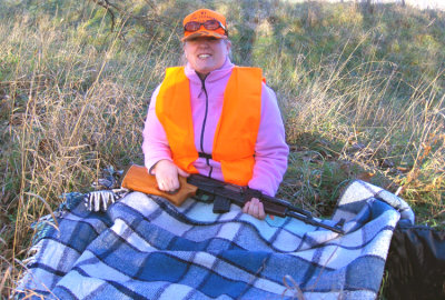 My baby hunts in a pink jacket, sitting on a blue plaid blanket. Now, honestly, how many of you can say that?