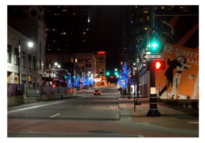 Running through the Power & Light District. I liked this shot as it showed the beauty of the city, the decorative holiday lights, as well as the reality of a construction zone which begets that beauty.