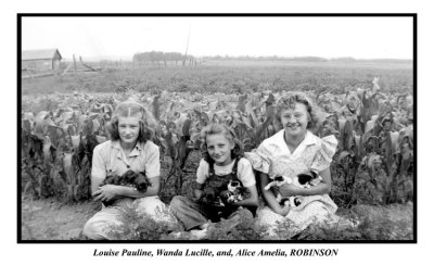 Three of the Robinson girls with their pets. This photograph was donated to us by, Nancy Ann [MACDOUGALL] Evans.