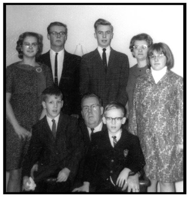 Standing we see: Cindy Lou, Gerald Everett, & John T. Hetrick, standing next to their mother, Louise Pauline [ROBINSON] Hetrick, who is standing next to, Barbara Jean Hetrick. Sitting we see: Rodney, George Raymond, & Gregory A. Mattson.