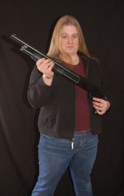 Salena Marie poses with her new toy. For Valentine's Day, she got a brand new 12 gauge pump shotgun. Now she can protect her daughter from wanton bad guys & look stylish too.
