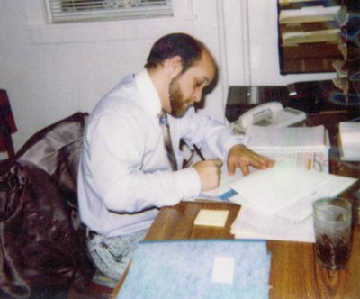 I was working for the Nebraska Department of Social Services, running a group home for troubled teens in Columbus. I was called in on Christmas night to quell some trouble & figured I'd get in some paper work before I went home. One of my charges came in and took this picture. That seems like a million lifetimes ago.