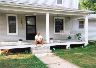 I had my picture taken on the steps of the house my great maternal grandfather built in 1901.