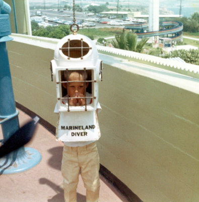 Again, I didn't want my picture taken here either. My father told me to stand under this silly prop. I knew better. At six years old, I knew better. This day blew.