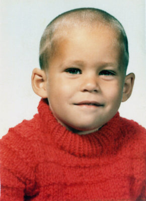 I'm not quite sure whose idea it was to have me looking like Ghandi, but for two solid years I did. I do however, remember that orange sweater. It was made for me by my grandmother, so I was ordered to wear it. Actually, if I remember correctly, I loved the thing.