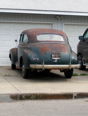 I saw this car sitting in a driveway while paying some bills this morning. No, I rarely go anywhere without a camera.