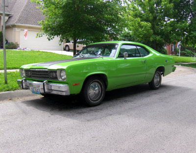 Right across the street, not twenty feet away from the blue Bug, was this lime green Duster, from days gone by. I spent many an hour in a car just like this one, many, many lifetimes ago.