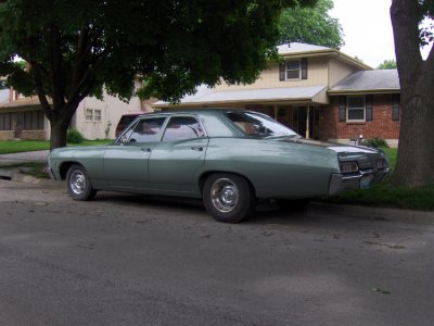 Beautiful Four door posted Chevy. I saw this car sitting on the street in Northtown the other morning as I was paying bills. It was on the very same block as the blue Bug shown 5 rows below. As a matter of fact, this car was parked BEHIND the Bug.