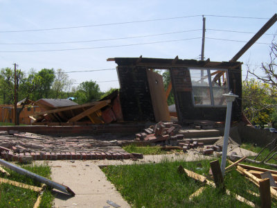 We knew nothing could be saved after the storm. Still, as we looked at the wreckage of someone's home a week later, it came as a sad surprise to note they were preparing to bulldoze this entire corner.