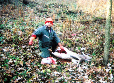 I enjoy deer hunting. I'm not a freak, I simply enjoy it. Here I'm up to my elbows in deer blood & guts.