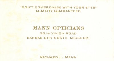 Business card for Mann Optical.