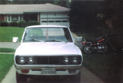 Here she sits in the driveway of my house in Lincoln. Shown in the background is another of the many motorcycles I've owned over the years. Right after I took this picture I put the cover plate back on the front blinker light.