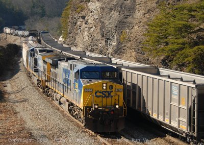 Q302 Meets westbound hoppers at Moss Run.