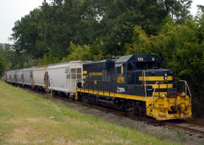 Shortline Atlantic  WEstern power is with a train at Sanford NC.jpg