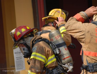 Firefighters getting ready to enter a building.jpg