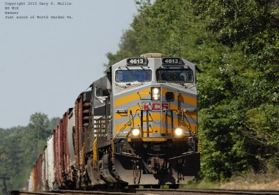 With heat rising from the rails M1R is popping up over a hill at Hamner.jpg