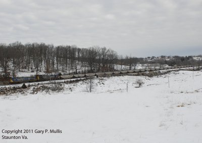 Westbound hoppers at Buttermilk Spring.jpg