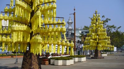 Fabric and aluminum lanterns.  Yellow is a sacred color, representing Buddha and the king.