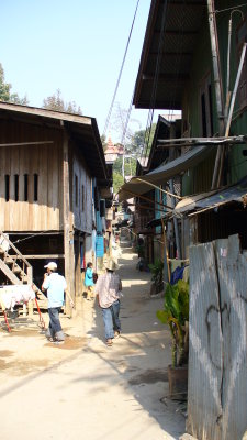 A traditional Burmese village, within the more modern border town.