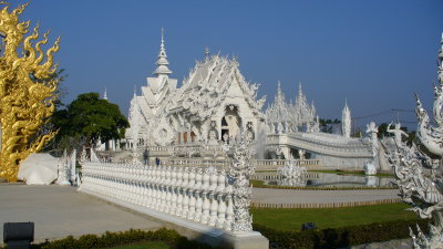 Driving from Chiang Rai to Chiang Mai, we stop at Wat Rong Khun, the White Temple.  It is a modern work in progress.